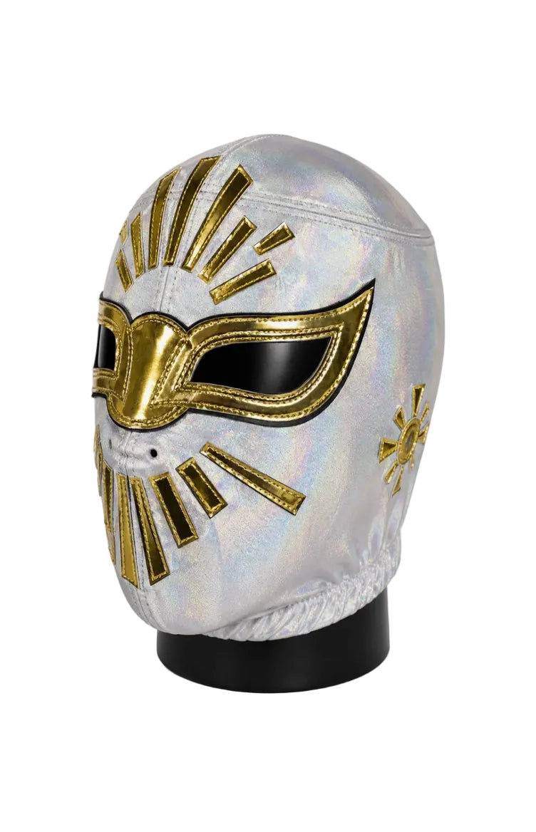 Decorative mask with gold and black accents on a white background